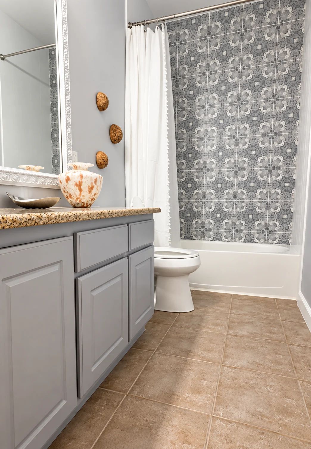 Bathroom vanity, patterned shower tile and coordinated finishes